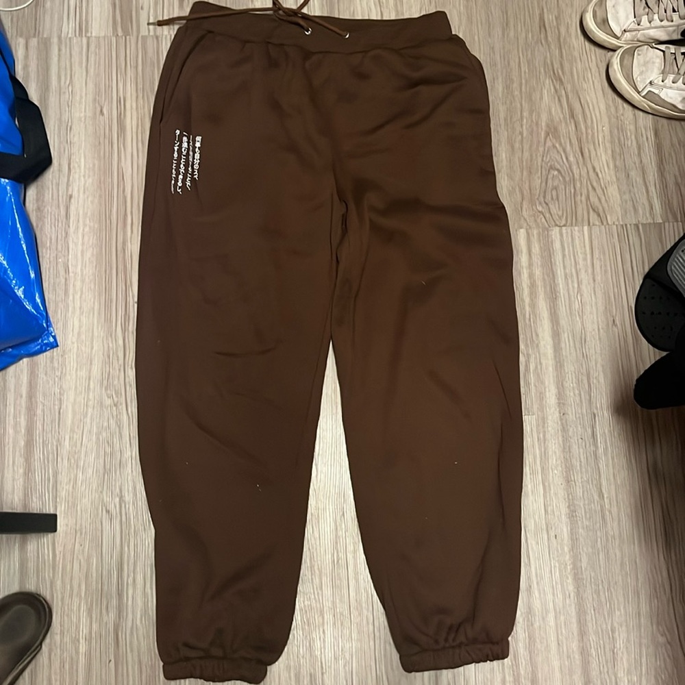 Brown sweatpants with Japanese writing